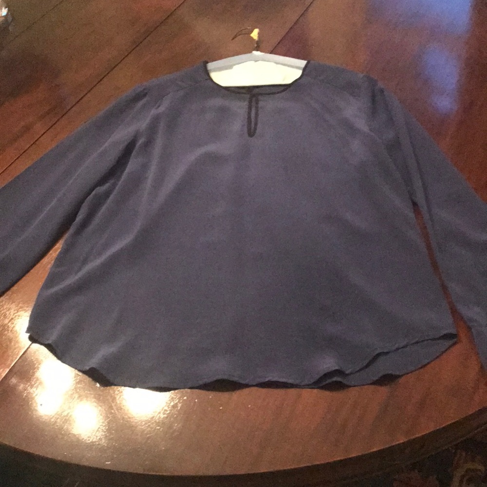Blue silk top with black trim